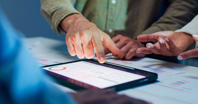 A fleet business owner reviews data from the use of a fuel card.