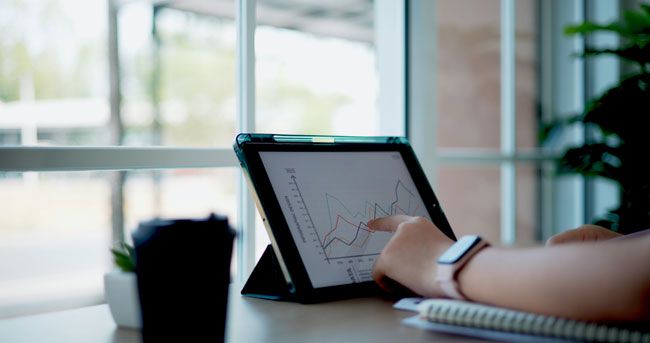 A small business owner reviews the data from her small fleet of vehicles and the use of their fleet card.