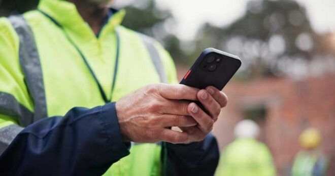 A business owner reviews fraud alerts while on-the-go from his cell phone.