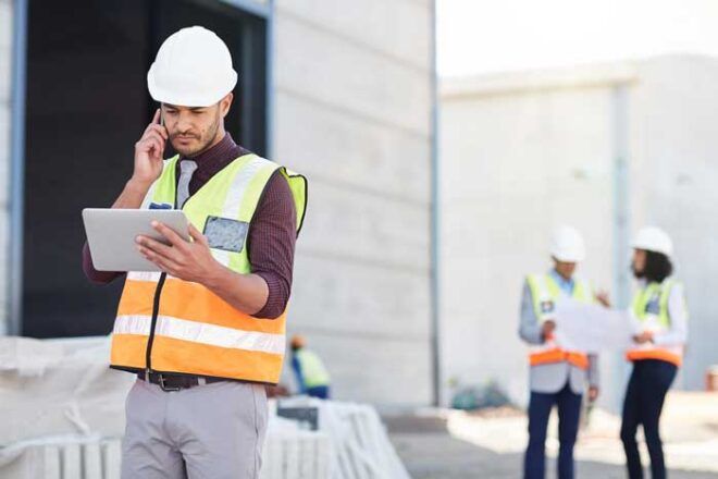 A business owner is able to track real-time usage of fleet fuel cards on his tablet on the construction site.